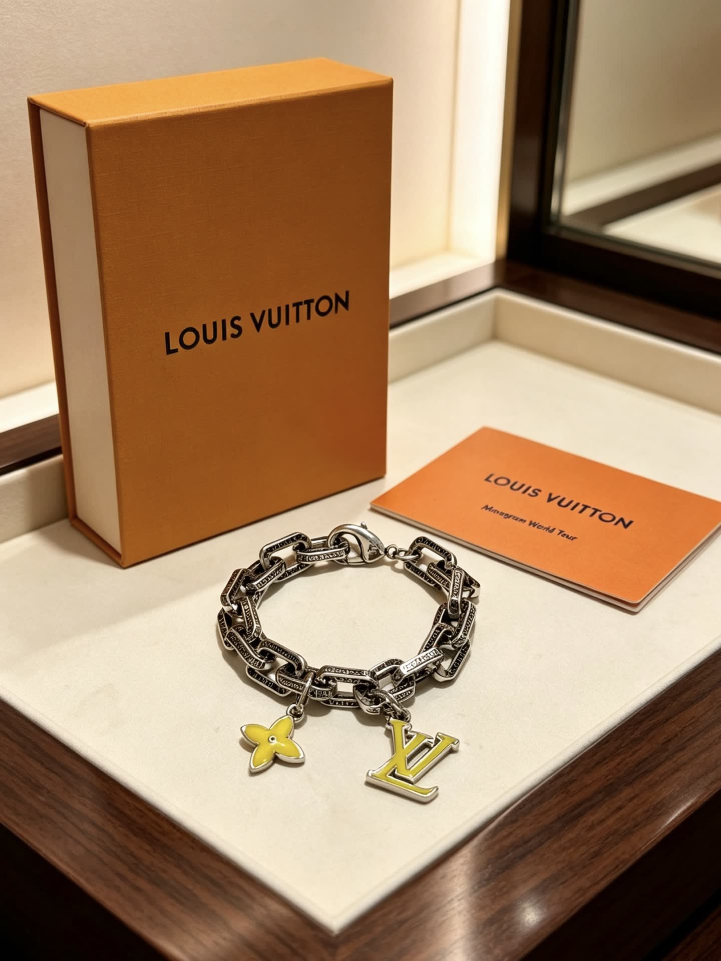 Louis Vuitton Silver Bracelet with LV Logo and Flower Charm
